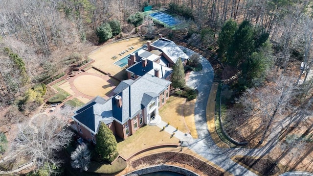 drone / aerial view featuring a forest view