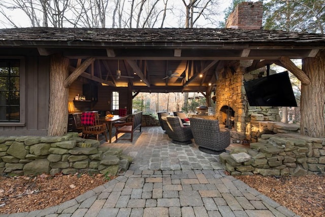 view of patio / terrace featuring a gazebo and a fireplace