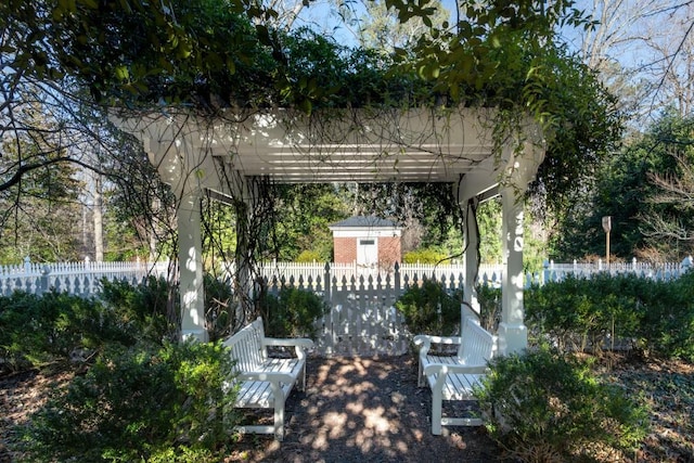 view of yard featuring a pergola and fence