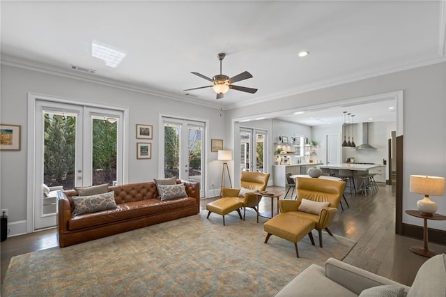 living room featuring visible vents, ornamental molding, french doors, baseboards, and dark wood-style flooring