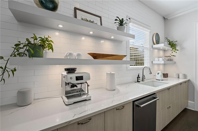 kitchen with open shelves, a sink, tasteful backsplash, stainless steel dishwasher, and light stone countertops