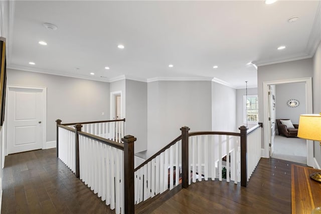 hall with recessed lighting, an upstairs landing, wood finished floors, and ornamental molding