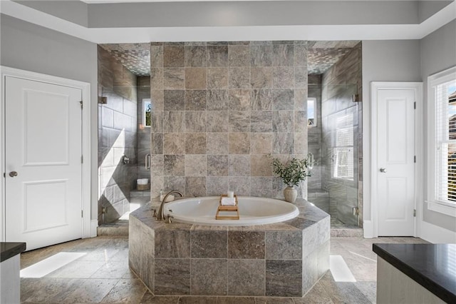 full bath featuring a garden tub and a stall shower