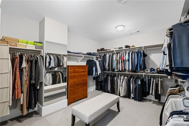 spacious closet with visible vents and carpet floors