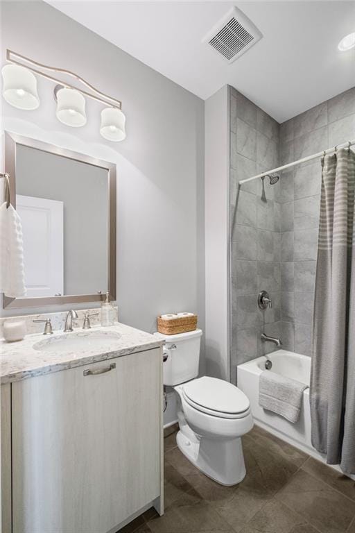 full bathroom with visible vents, shower / tub combo, toilet, and vanity