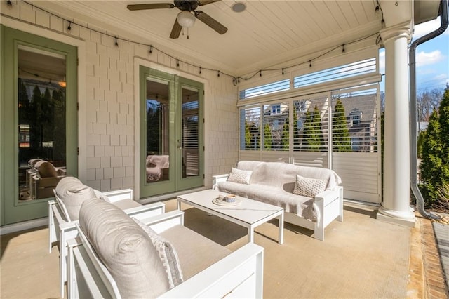 view of patio / terrace with an outdoor living space, french doors, and a ceiling fan