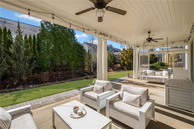 view of patio / terrace with stairs, an outdoor hangout area, and a ceiling fan