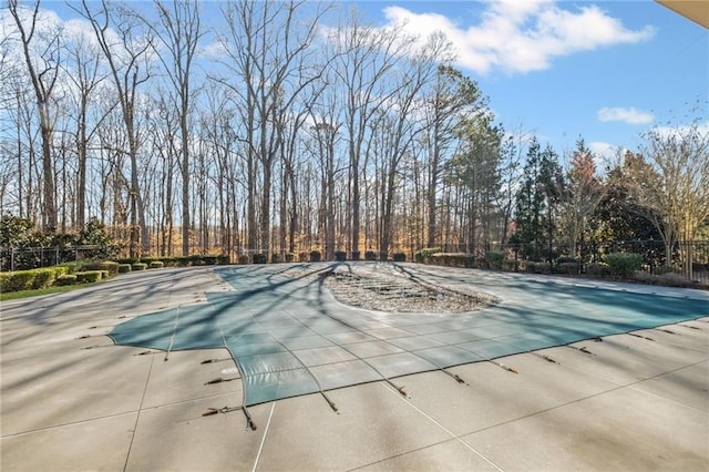 view of pool featuring a patio area, a fenced in pool, and fence