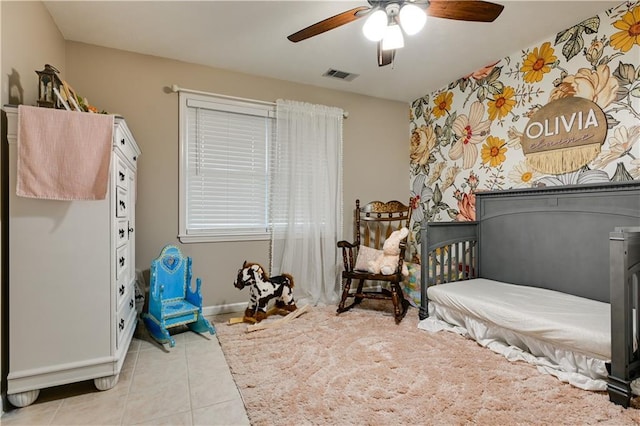 bedroom with light tile patterned floors and ceiling fan