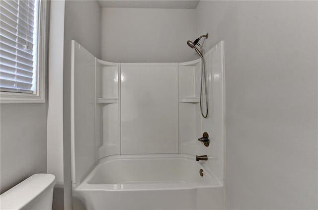 full bathroom featuring shower / bathtub combination and toilet