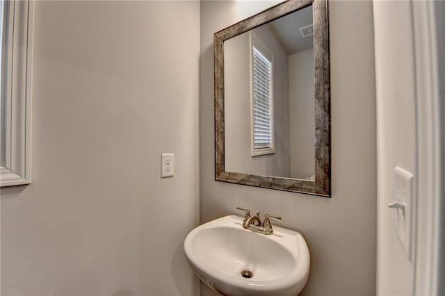 bathroom with a sink and visible vents