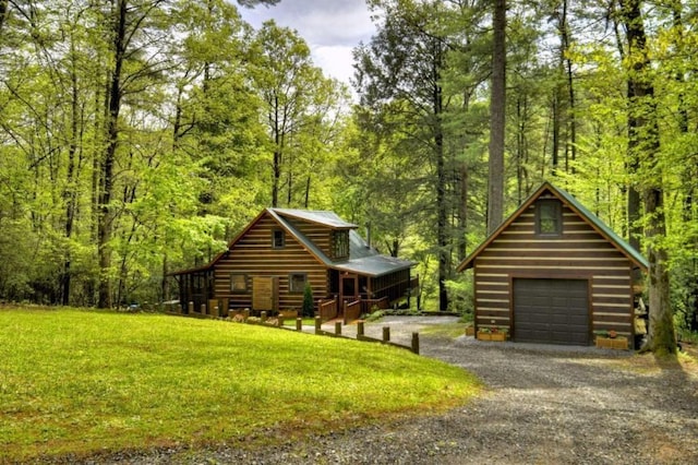 28452 Morganton Hwy, Suches, GA 30572 - view of front facade featuring a forest view, gravel driveway, a front lawn, and log exterior