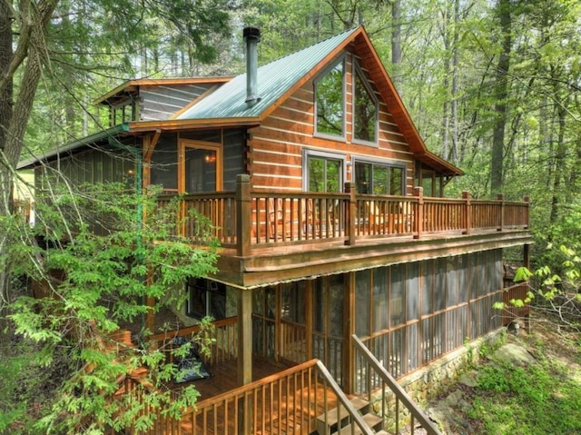 28452 Morganton Hwy, Suches, GA 30572 - rear view of house featuring a wooden deck, metal roof, and log exterior