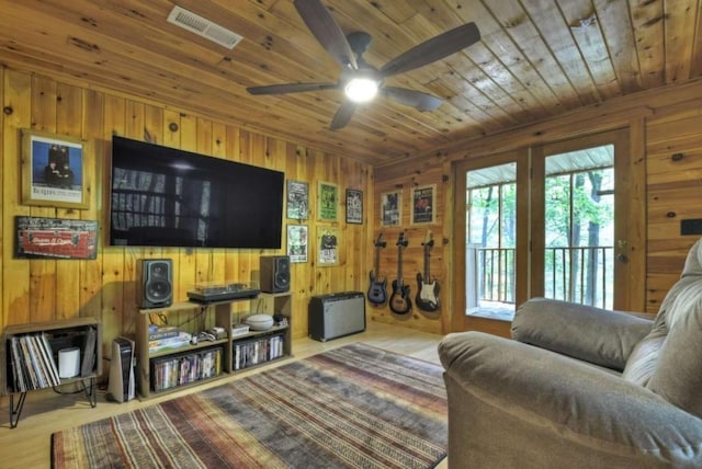 28452 Morganton Hwy, Suches, GA 30572 - living room featuring wooden walls, wood ceiling, ceiling fan, and wood finished floors
