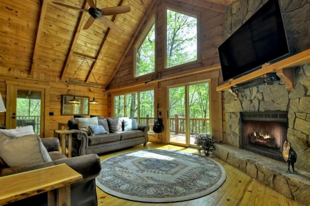 28452 Morganton Hwy, Suches, GA 30572 - living room featuring wooden ceiling with exposed beams, healthy amount of natural light, high vaulted ceiling, wood-type flooring, and ceiling fan