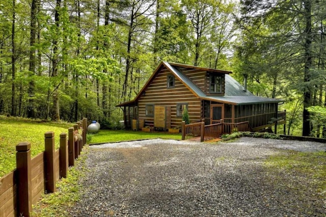 28452 Morganton Hwy, Suches, GA 30572 - view of front of property with driveway, a wooden deck, and a forest view