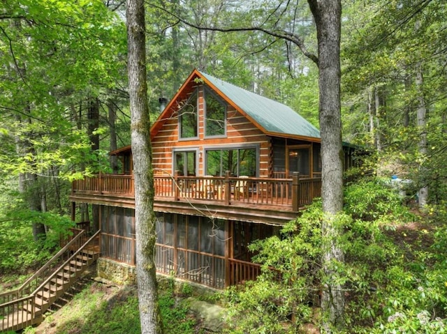 28452 Morganton Hwy, Suches, GA 30572 - rear view of house with a sunroom, a forest view, stairway, and a deck