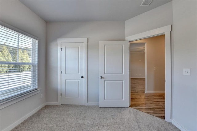 unfurnished bedroom featuring light wood-type flooring