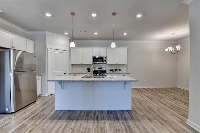 kitchen featuring a kitchen island with sink, white cabinetry, stainless steel appliances, and light wood-type flooring