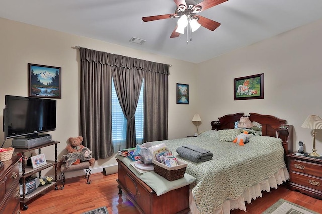 bedroom featuring ceiling fan and wood-type flooring