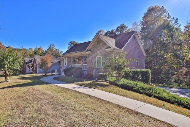 view of front of property featuring a front yard and a garage