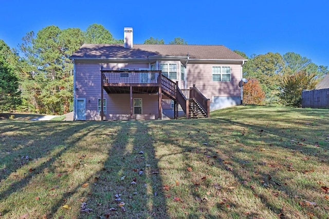 rear view of property featuring a deck and a lawn