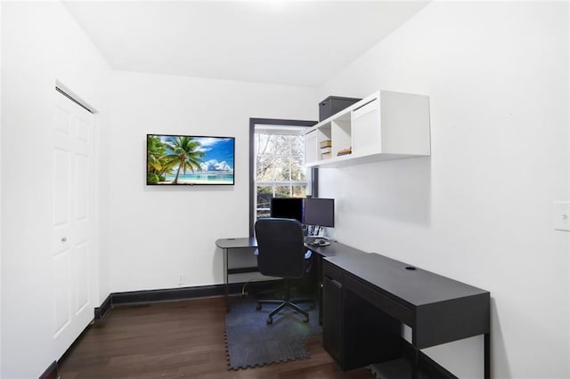 office space with dark wood-style floors and baseboards