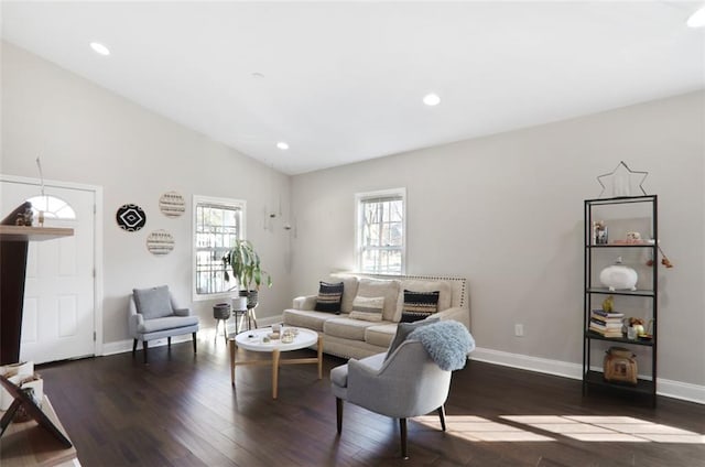 living area with recessed lighting, vaulted ceiling, and wood finished floors