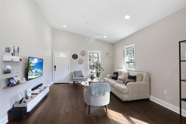 living room featuring lofted ceiling, recessed lighting, dark wood finished floors, and baseboards