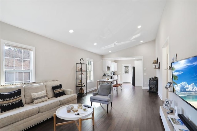 living area with lofted ceiling, dark wood-type flooring, baseboards, and recessed lighting