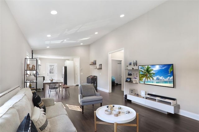 living room with baseboards, vaulted ceiling, wood finished floors, and recessed lighting