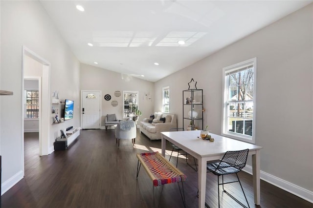 dining area featuring dark wood-type flooring, lofted ceiling, baseboards, and recessed lighting