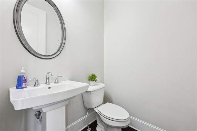 bathroom with sink and toilet