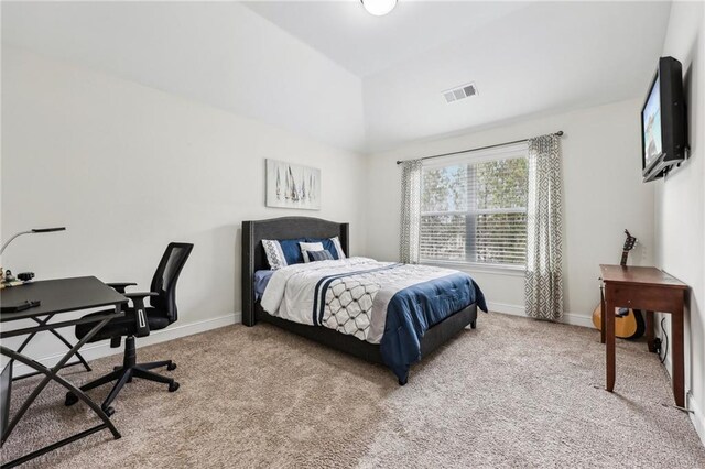 bedroom featuring light colored carpet