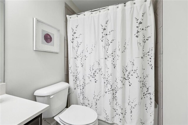 bathroom featuring vanity and toilet