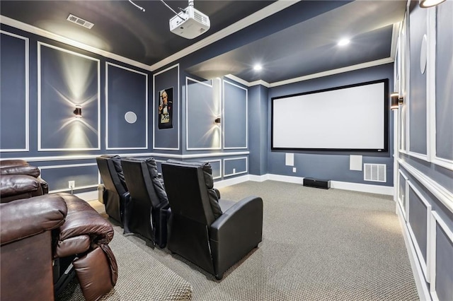 home theater room featuring ornamental molding and carpet flooring