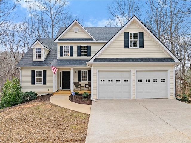 traditional-style home with driveway, covered porch, a garage, and roof with shingles