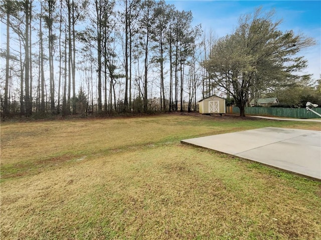 view of yard featuring a storage shed and an outbuilding