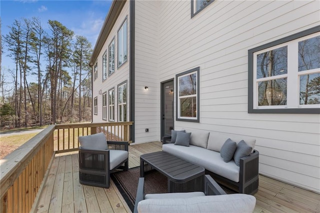 wooden deck with outdoor lounge area