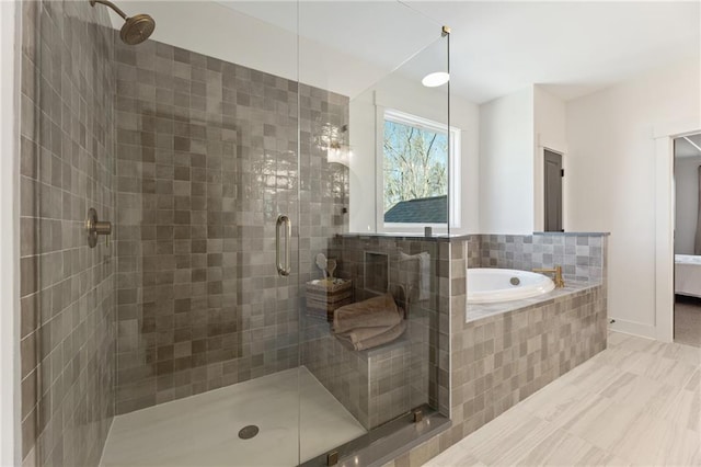 bathroom featuring a garden tub and a stall shower