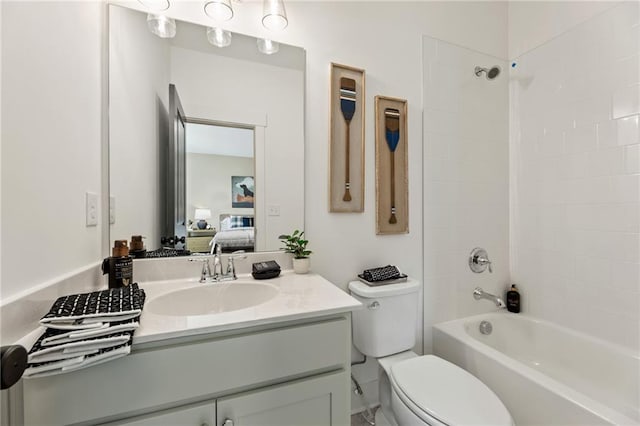 bathroom with toilet, shower / bathtub combination, connected bathroom, and vanity