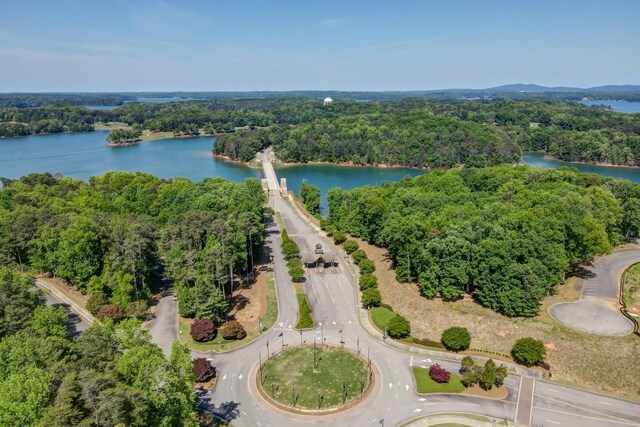 bird's eye view with a forest view and a water view