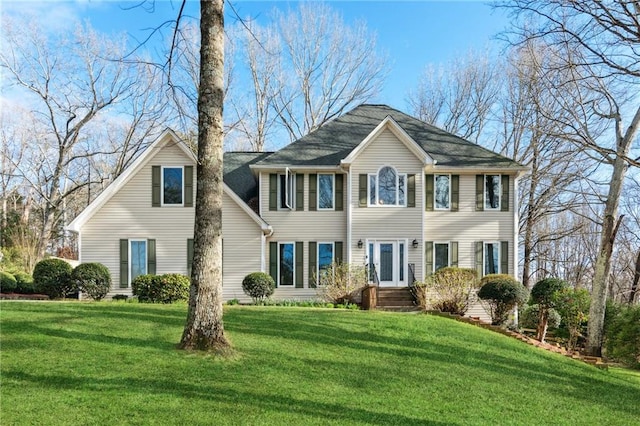 colonial inspired home with a front yard