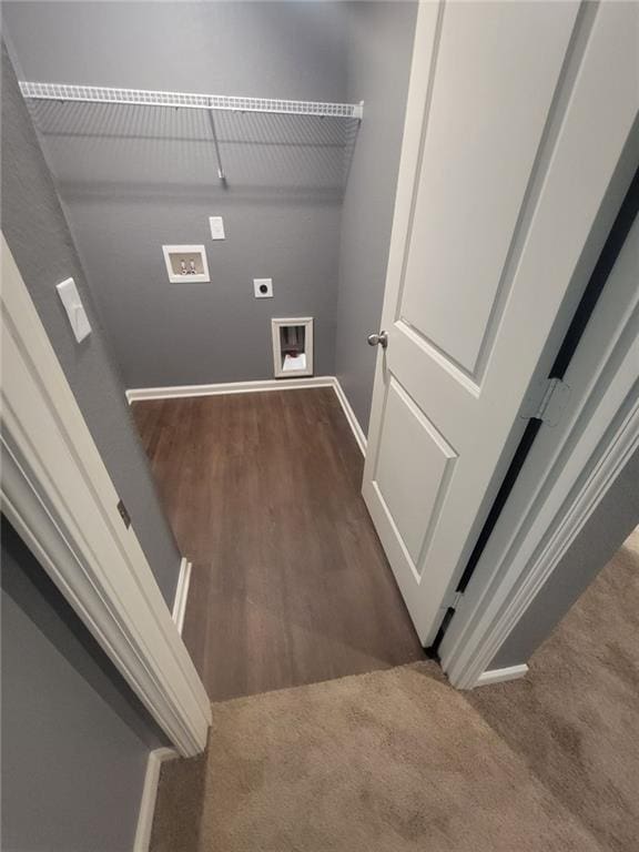 laundry room with hookup for an electric dryer, washer hookup, and dark wood-type flooring