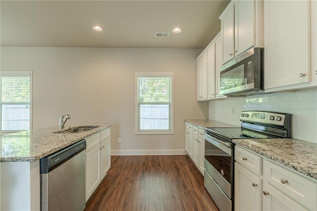 392 Dublin Way, Dallas, GA 30132 - kitchen with appliances with stainless steel finishes, white cabinets, a sink, visible vents, and dark wood-type flooring
