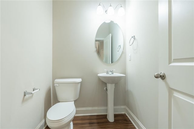 392 Dublin Way, Dallas, GA 30132 - bathroom with wood finished floors, toilet, and baseboards