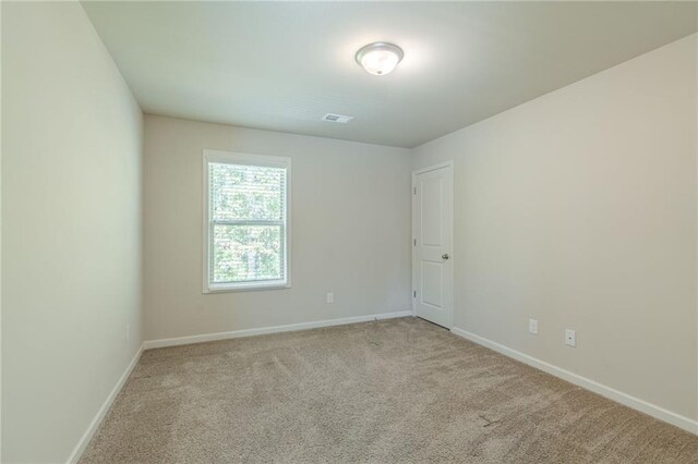 392 Dublin Way, Dallas, GA 30132 - carpeted empty room featuring visible vents and baseboards