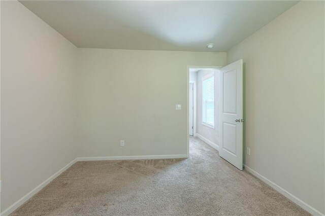 392 Dublin Way, Dallas, GA 30132 - spare room featuring baseboards and light carpet