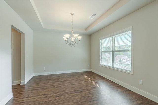 392 Dublin Way, Dallas, GA 30132 - empty room featuring a raised ceiling, visible vents, dark wood-style floors, baseboards, and a notable chandelier