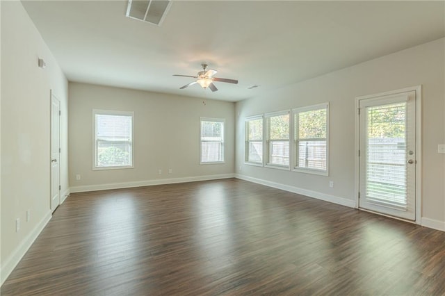 392 Dublin Way, Dallas, GA 30132 - empty room with a healthy amount of sunlight, baseboards, a ceiling fan, and dark wood-style floors